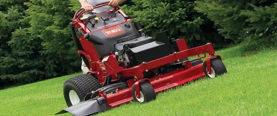 One of our team members mowing a clients lawn in Grand Rapids, MI.