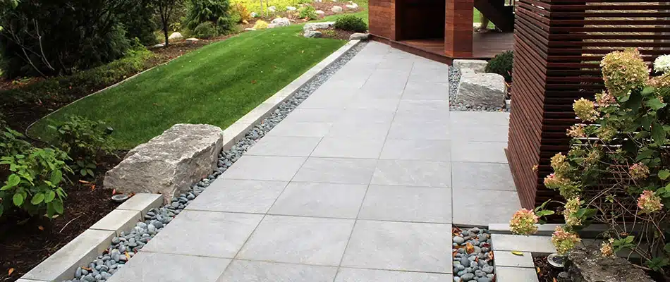 Custom walkway beside freshly mowed lawn in West Olive, MI.