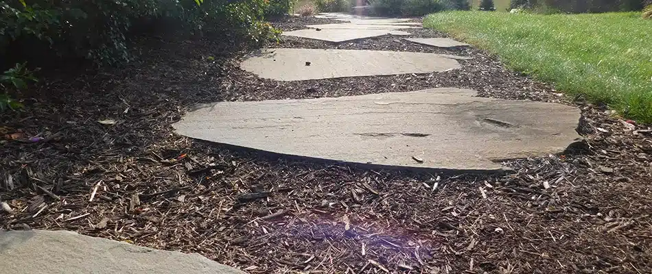 Mulch added to walkway and landscape bed in Marne, MI.