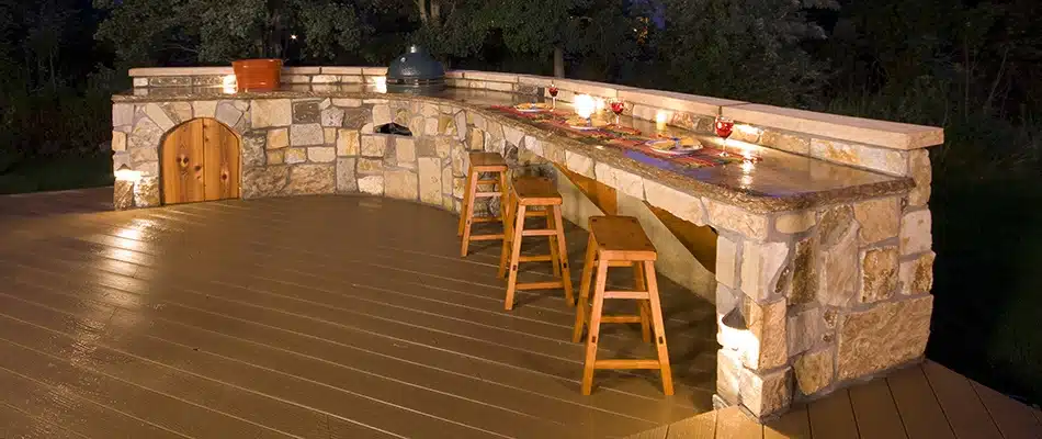 Outdoor lighting installed around outdoor kitchen in Grand Rapids, MI.