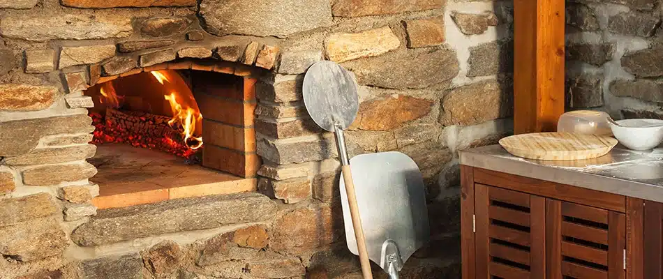 A pizza oven installed with outdoor kitchen hardscape in Coopersville, MI.