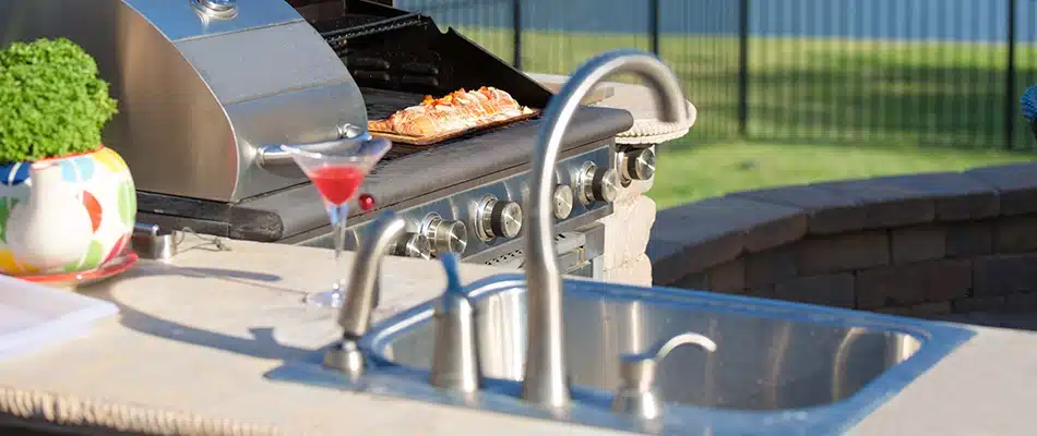 A sink installed with an outdoor kitchen build in Walker, MI.